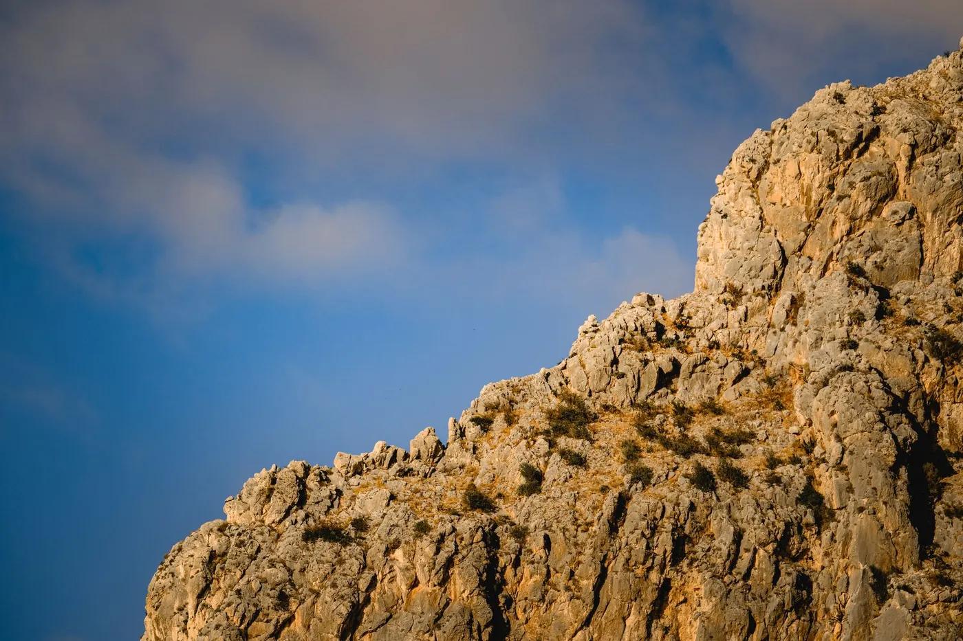 Captivating rock formation under a clear sky, showcasing natural geology.