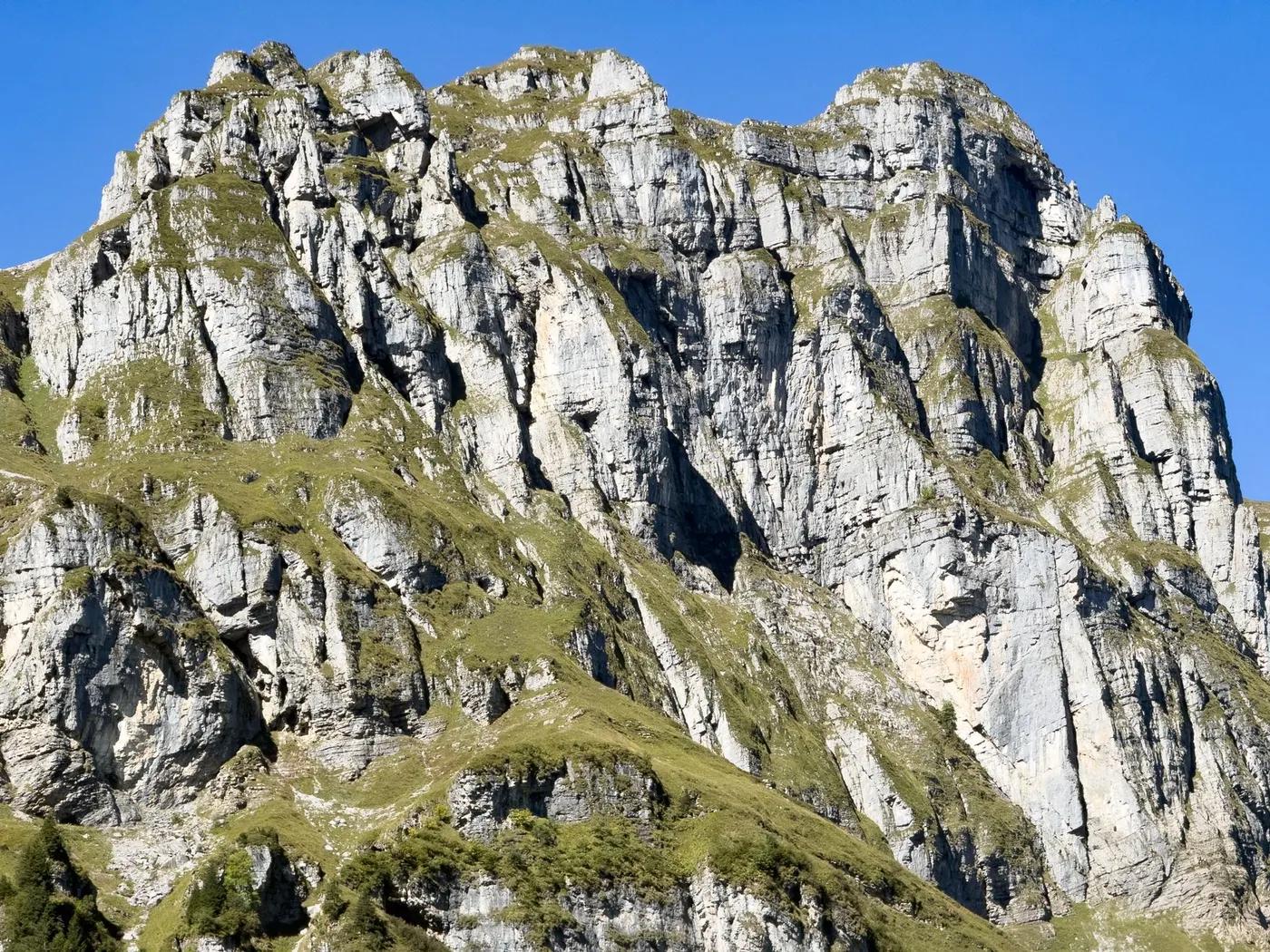 Stunning view of rugged peaks and geological formations in Muotathal, Schwyz, Switzerland.