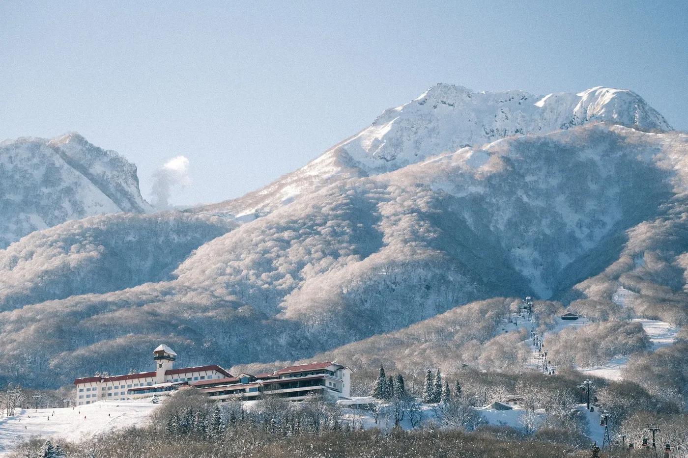 Scenic winter view of a ski resort nestled in the snowy Japanese Alps.