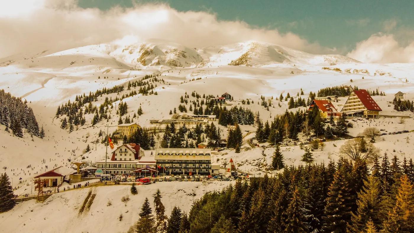 A picturesque ski resort in North Macedonia, showcasing snow-covered mountains and vibrant winter activities.