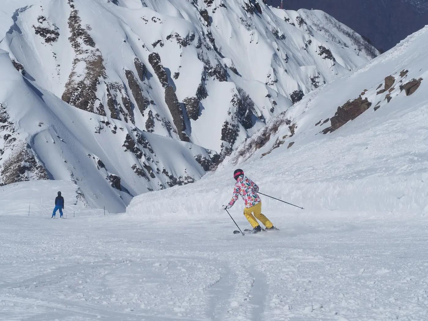 Skiers enjoying a winter adventure on snowy mountains in Russia.