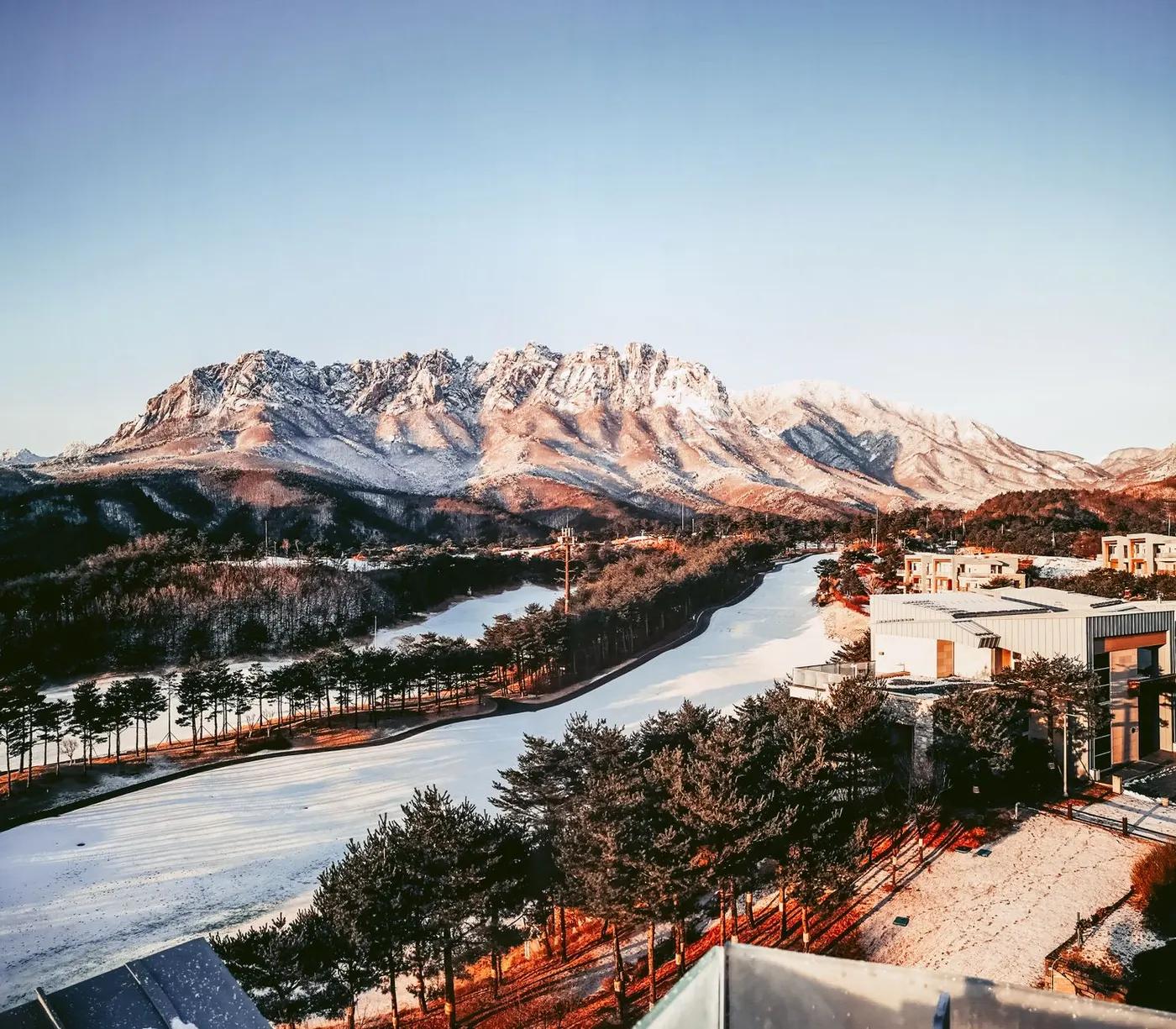 Aerial view of a snow-covered mountain landscape in South Korea during winter.