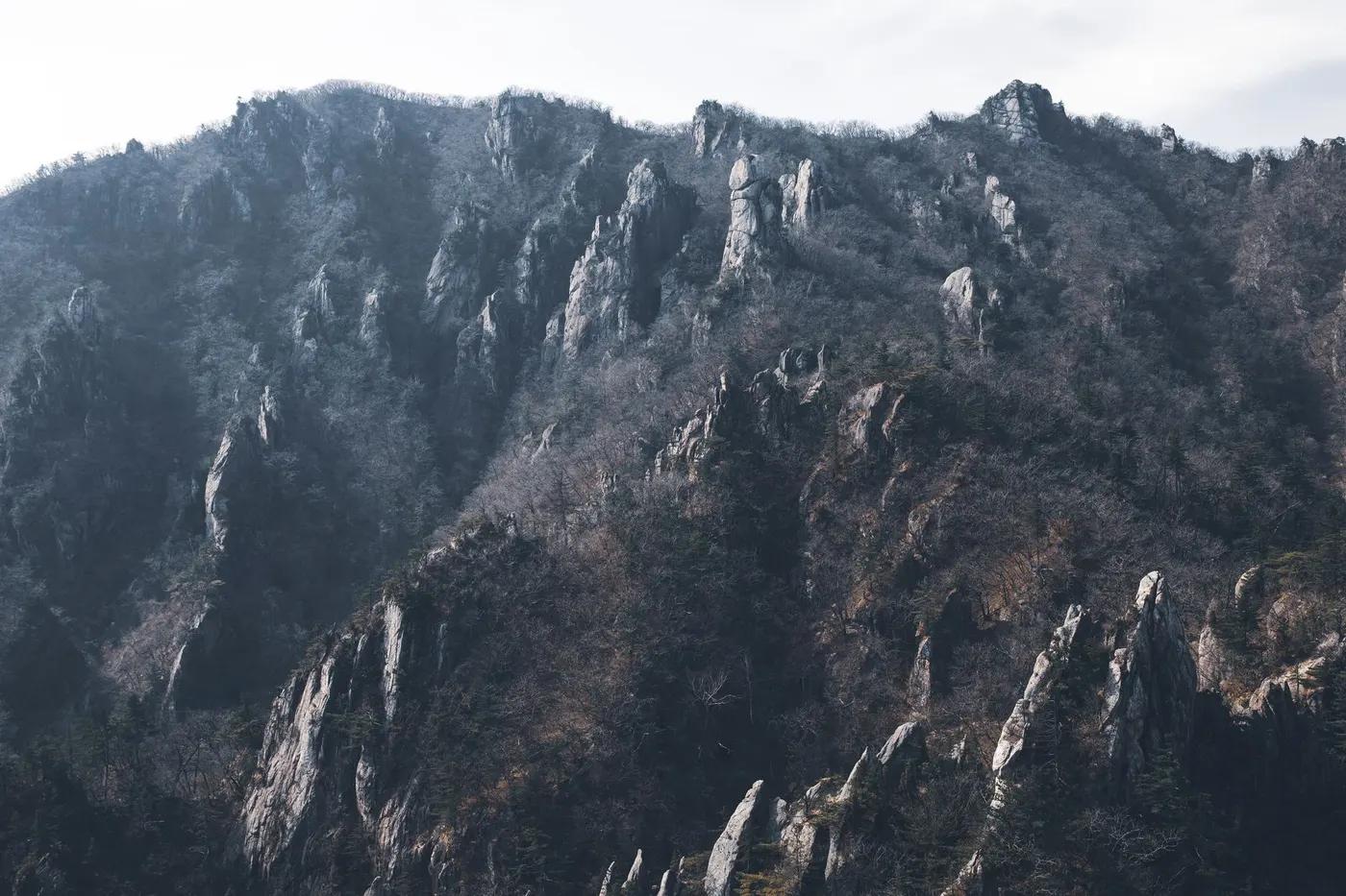 Captivating view of rocky mountain peaks in Yangyang, South Korea, showcasing nature's rugged beauty.
