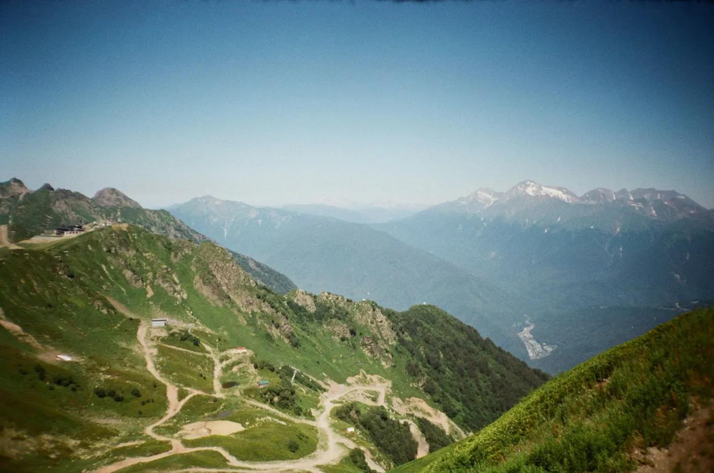 Experience the breathtaking mountain landscapes of Sochi, Russia, captured from above.