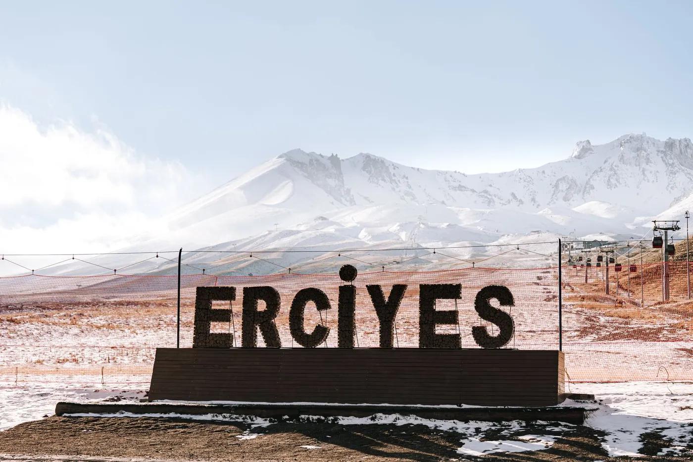 Scenic view of Mount Erciyes with snow and iconic Erciyes sign, Turkey.