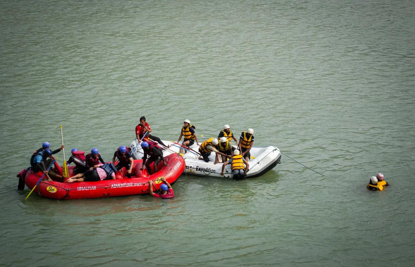 Group rafting on Ganges River in Rishikesh, India showcasing teamwork in action.